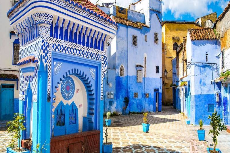 Quiet street in Chefchaouen with blue painted walls and Rif Mountains charm featured during 6 days tour from Tangier to Marrakech.
