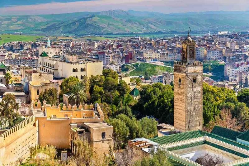 Panoramic view of Fes medina with historic buildings and skyline featured during 6 days tour from tangier to marrakech.