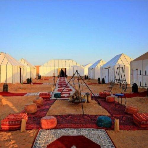 Layali luxury desert camp in Merzouga Sahara with elegant tents and dunes featured during moroccocameltrips travel experience.